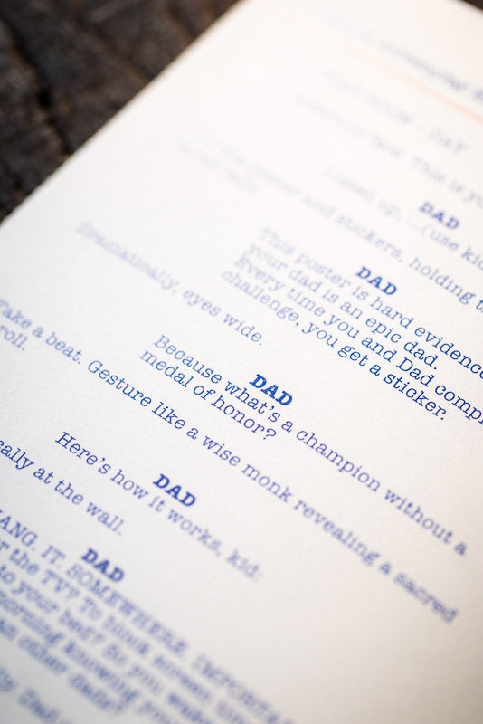 Close-up of a book with text on a wooden surface